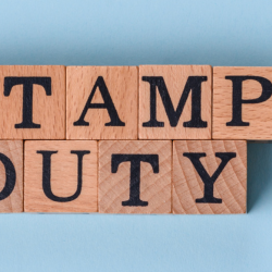 Image of blocks spelling "Stamp Duty" and a Home