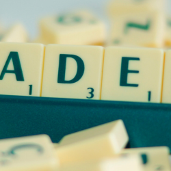 Image of Academy spelt out on scrabble stand
