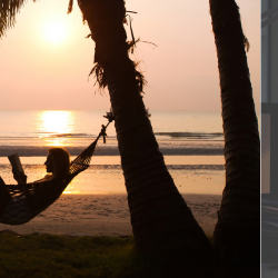 Image of an employee working overtime and another on holiday.
