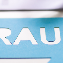 Speech bubble saying Fraud with some corporate papers in the background
