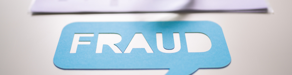 Speech bubble saying Fraud with some corporate papers in the background
