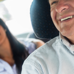 Image of a taxi driver with passengers
