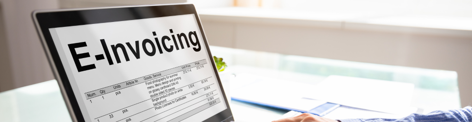Image of a laptop with e-invoicing on screen