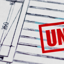 Image of an unpaid stamp on construction plans for web header