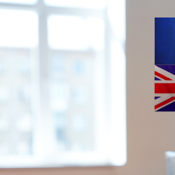 Image of negotiations wih European flag and United Kingdom flag on the wall.