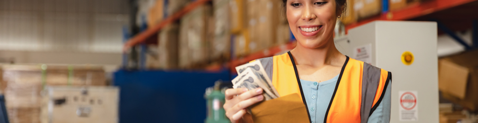 Image of a warehouse worker receiving overtime pay