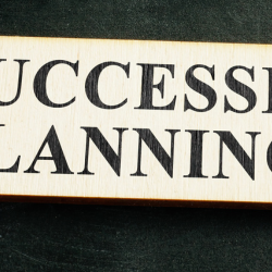 An arrow which reads succession planning for article header image.