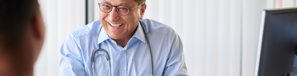 Image of a GP smiling for article header iamge