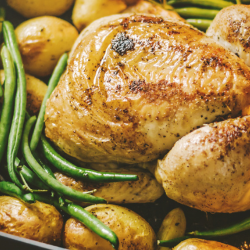 Image of a chicken coming out the oven