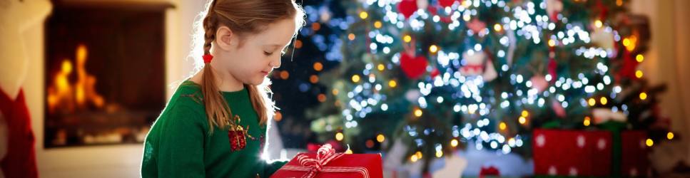 Child Arrangements during the festive period, image of a child opening christmas presents
