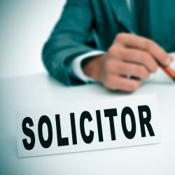 What does a solicitor do when buying a house