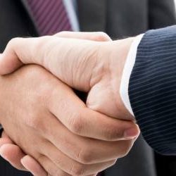 Image of two business men shaking hands - Sales, Mergers and Acquisitions page
