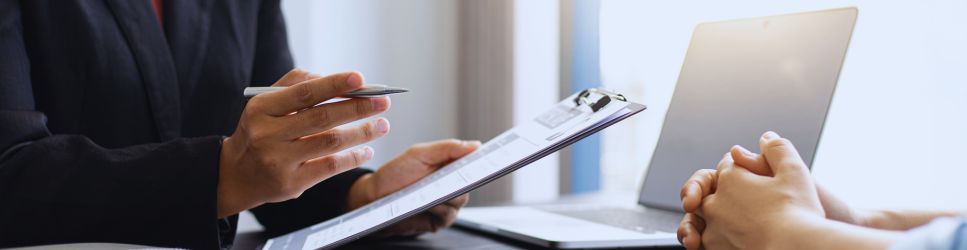 Image of employer talking to employee as header image for Employers' Duty to Prevent Sexual Harassment in the Workplace