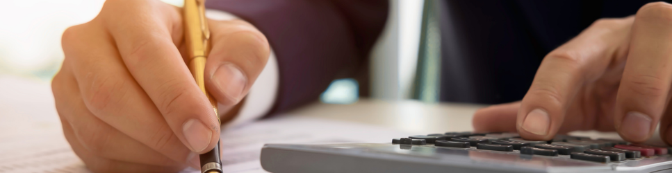 Image of a solicitor with a calculator - Costs of litigation header image