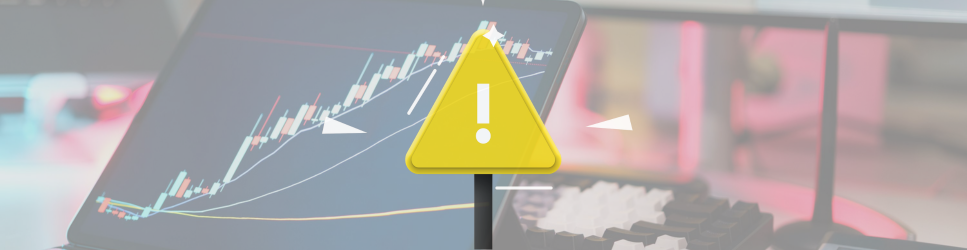 Image of a warning sign over a tech and finance background image.