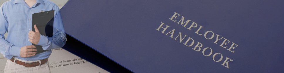 Image of an employee and an employment handbook for Employment Rights Header Image.