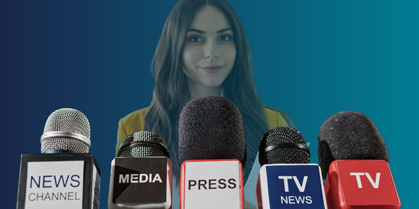 Image of a person obscured by press microphones