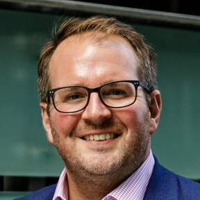 tom evans profile headshot